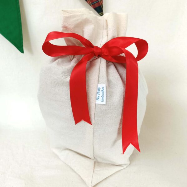 Calico reusable fabric gift bag. The Party Godmother Christmas party supplies.